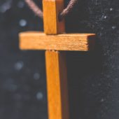 brown-wooden-cross-pendant-on-closeup-photography-792953-scaled-1.jpg